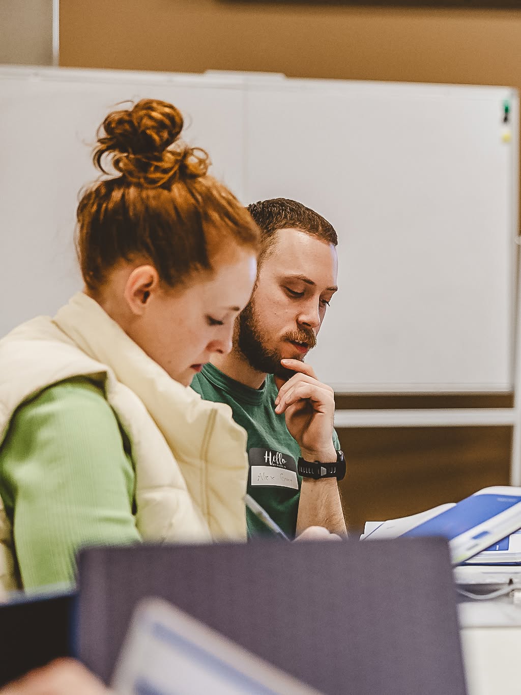 A couple studying side by side during a lesson